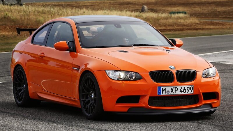 orange BMW M3 on racetrack