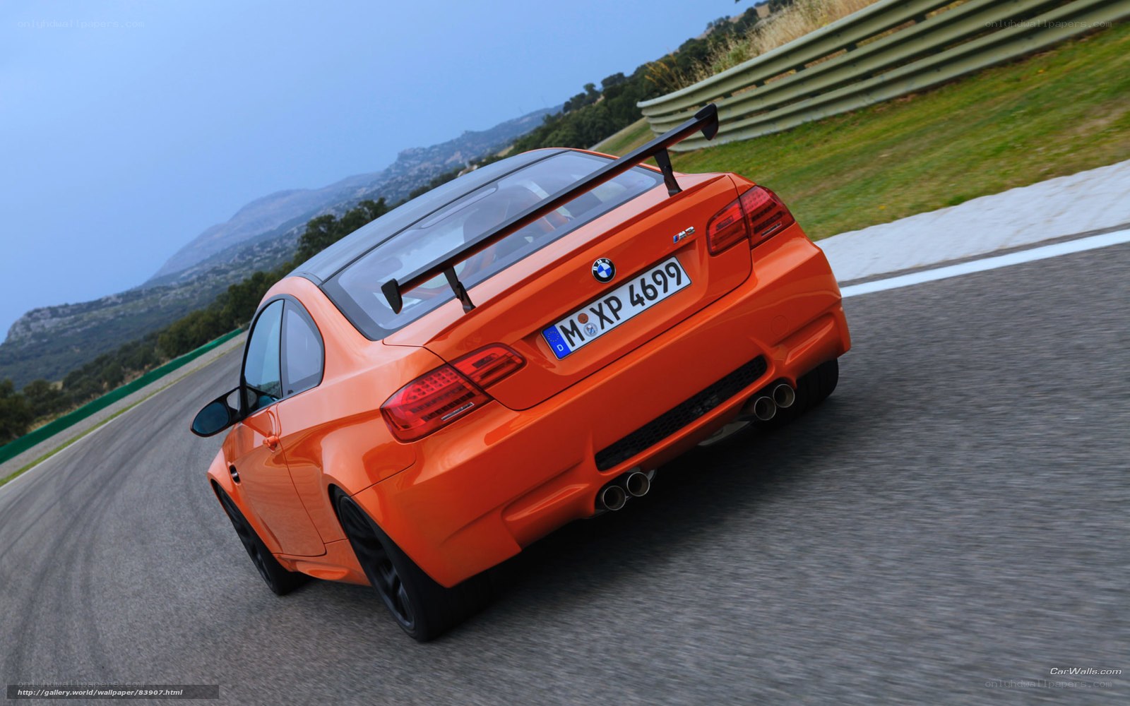 orange bmw m3 on racetrack