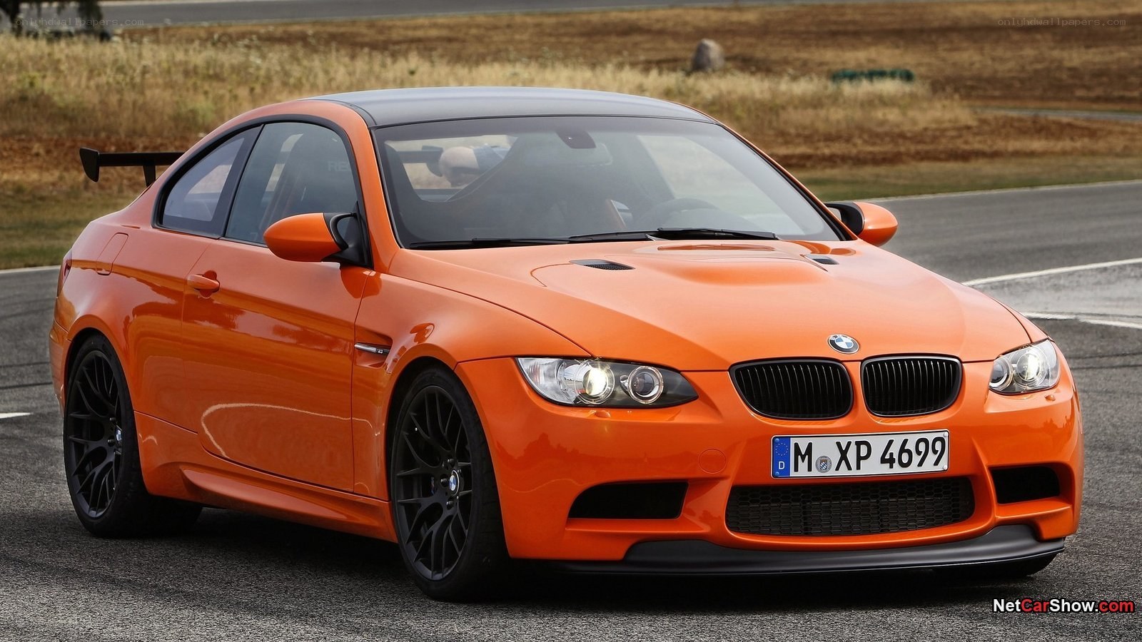 orange bmw m3 on racetrack