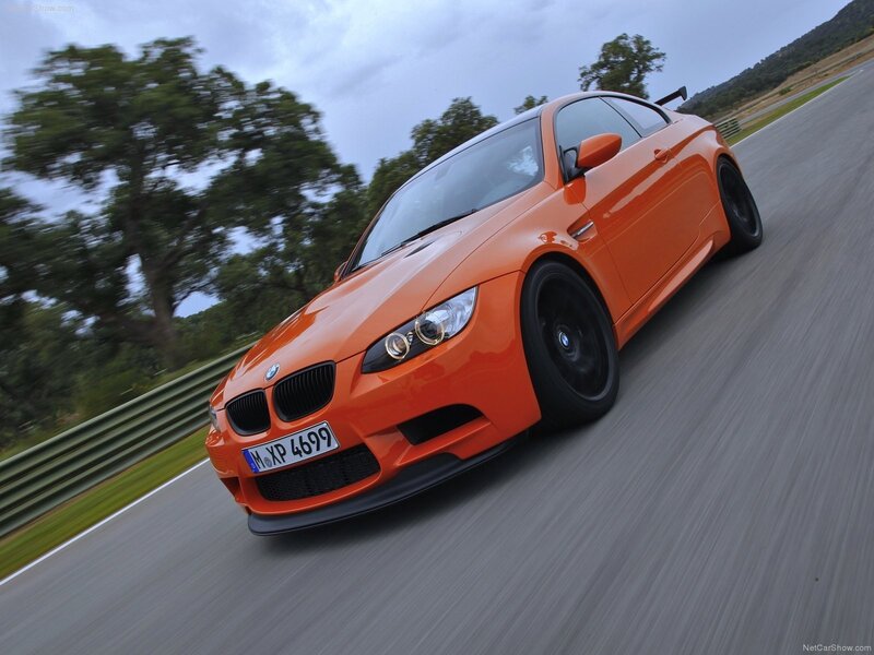 orange bmw m3 on racetrack