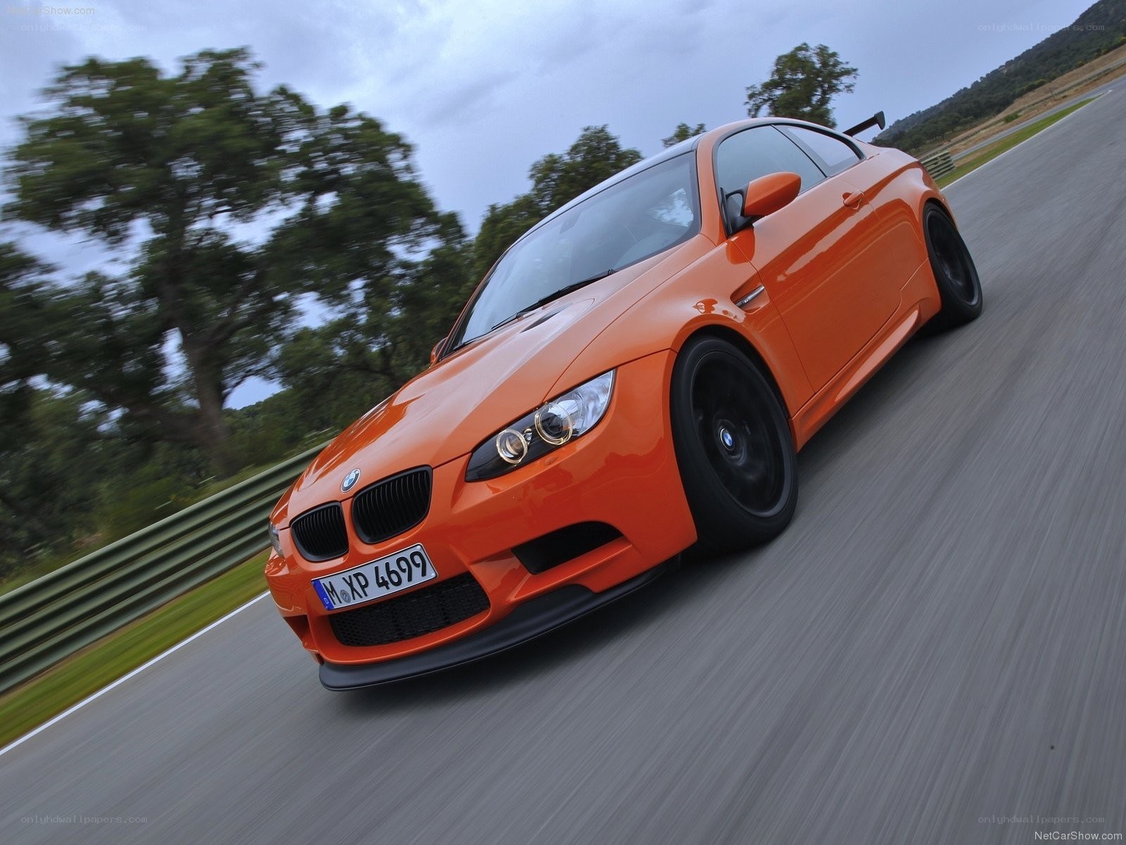 orange bmw m3 on racetrack