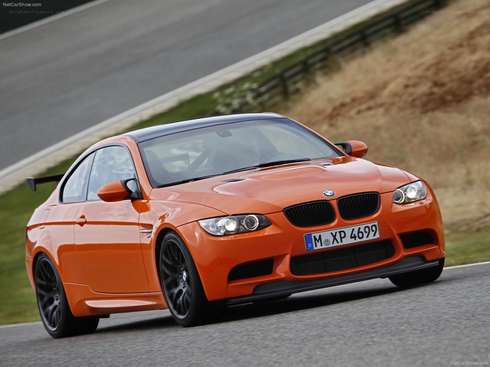 orange bmw m3 on racetrack