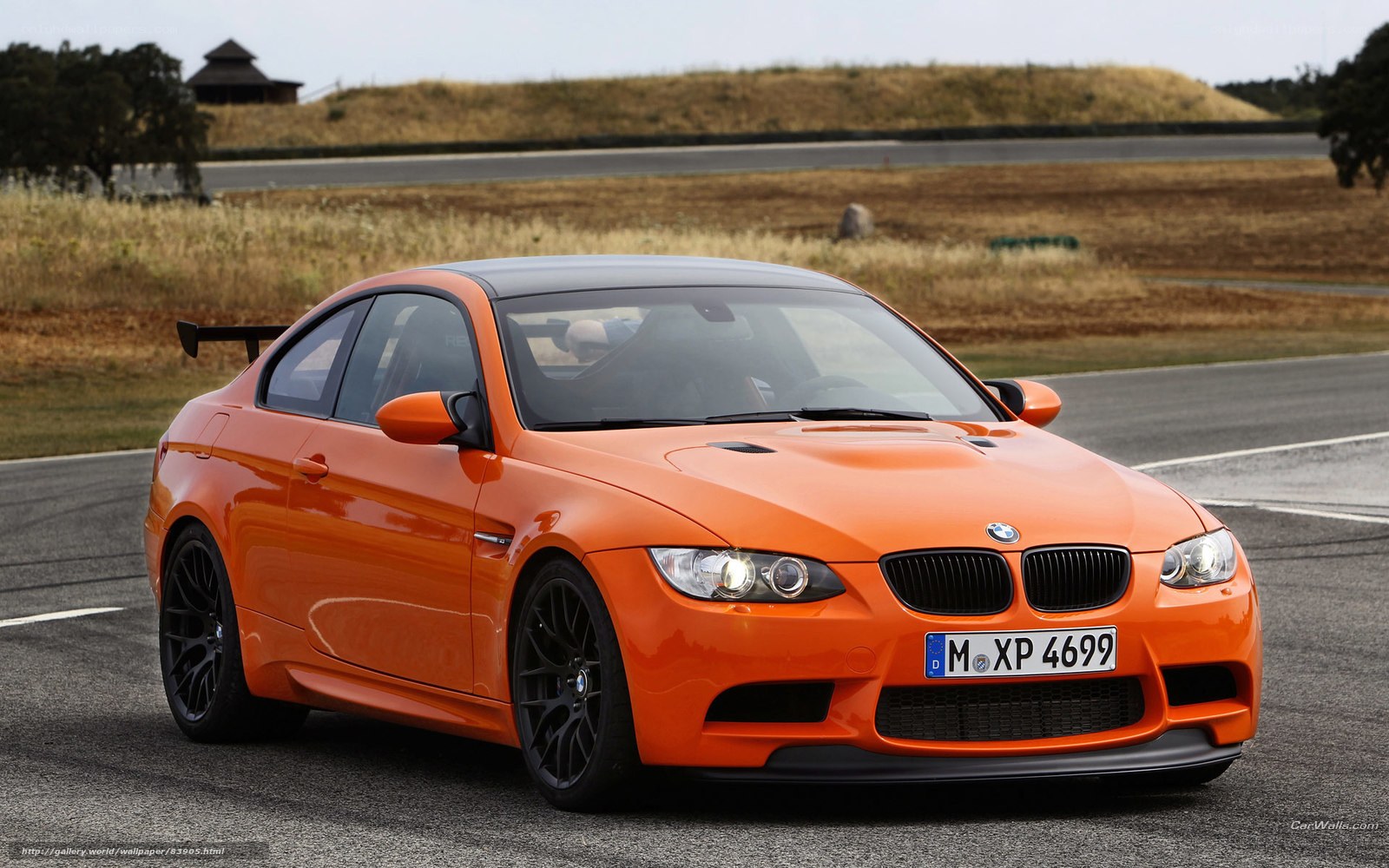 orange bmw m3 on racetrack