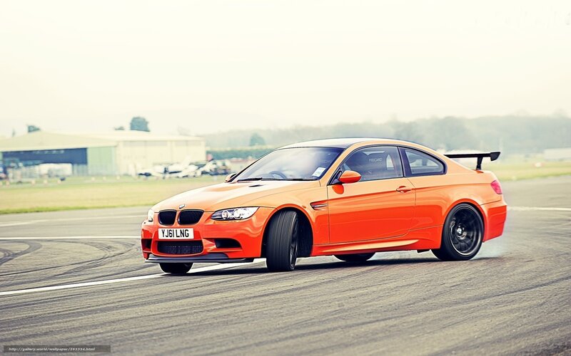 orange BMW M3 on track