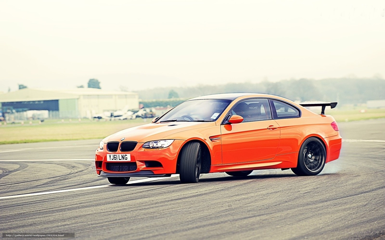 orange BMW M3 on track
