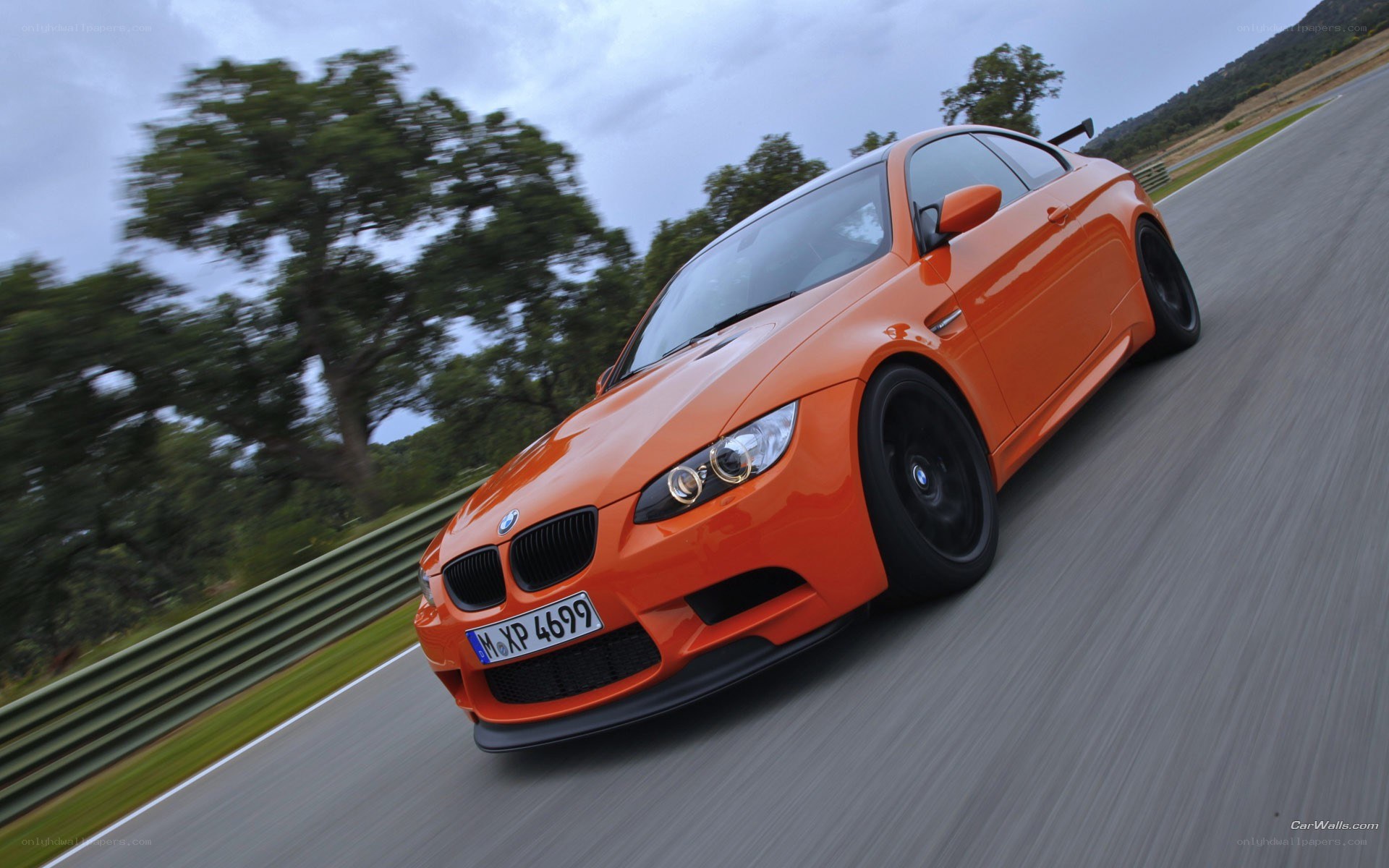 orange bmw m3 on track