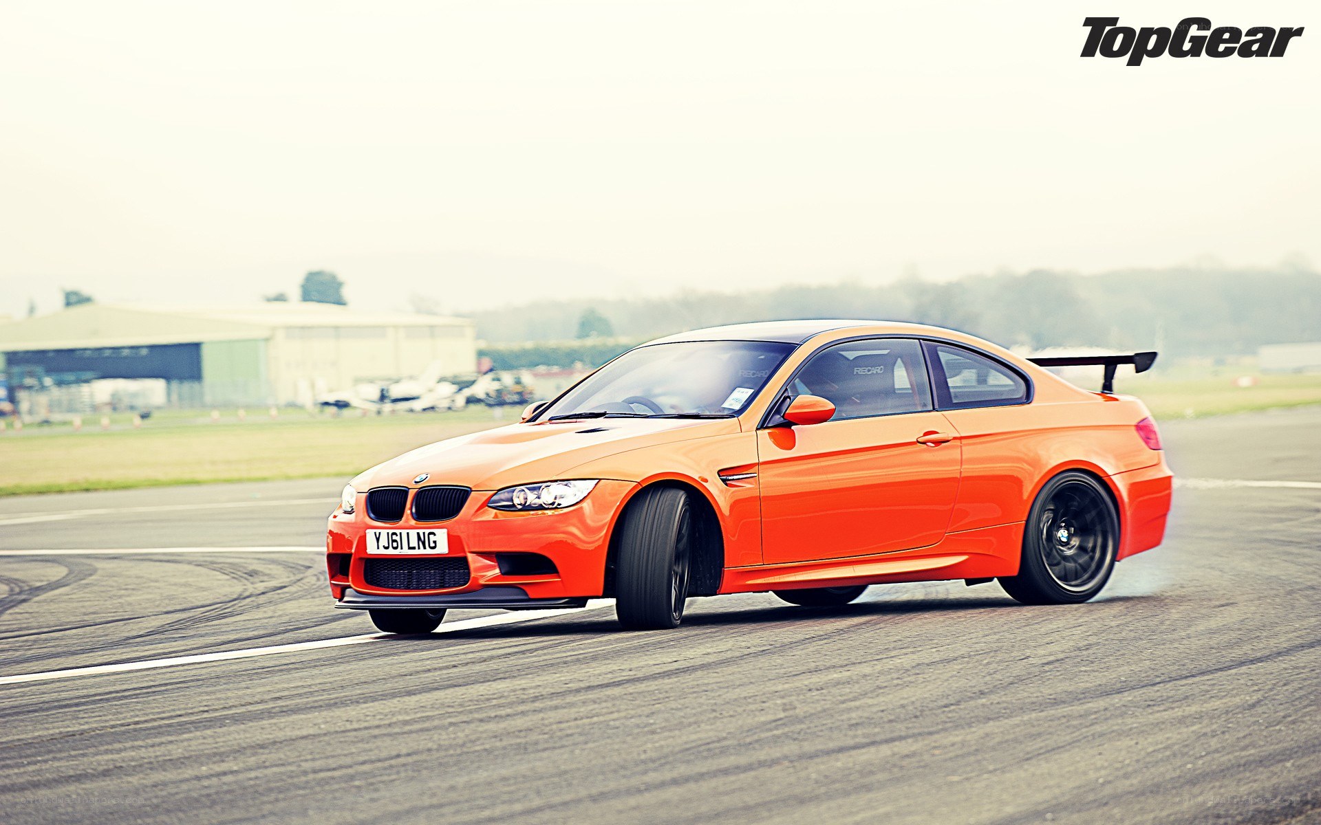 orange BMW M3 on track