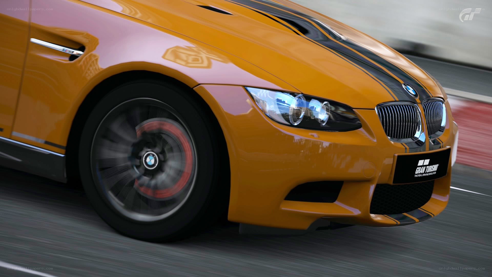 orange bmw m3 on track