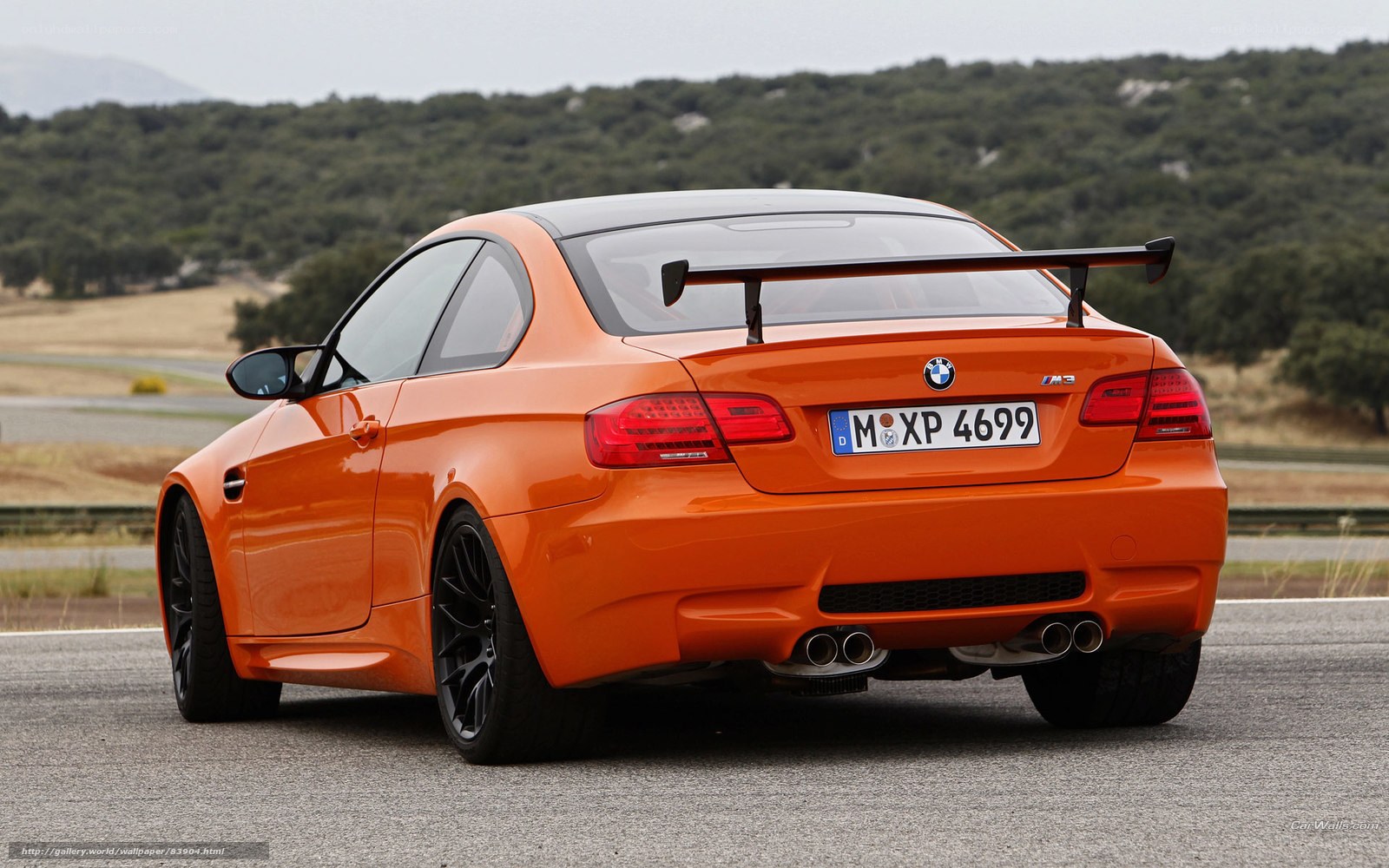 orange bmw m3 on track