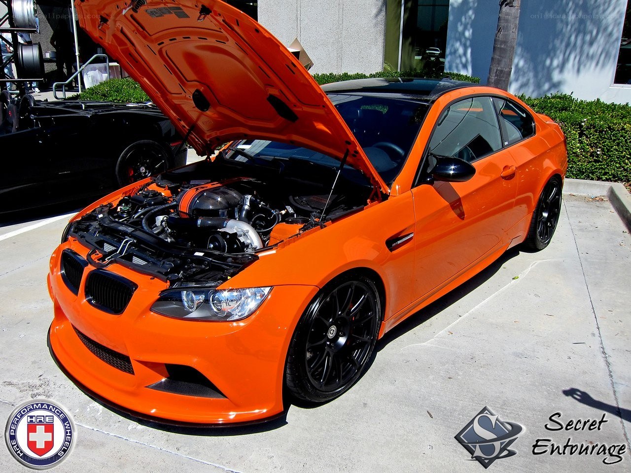 Orange BMW M3 with open hood