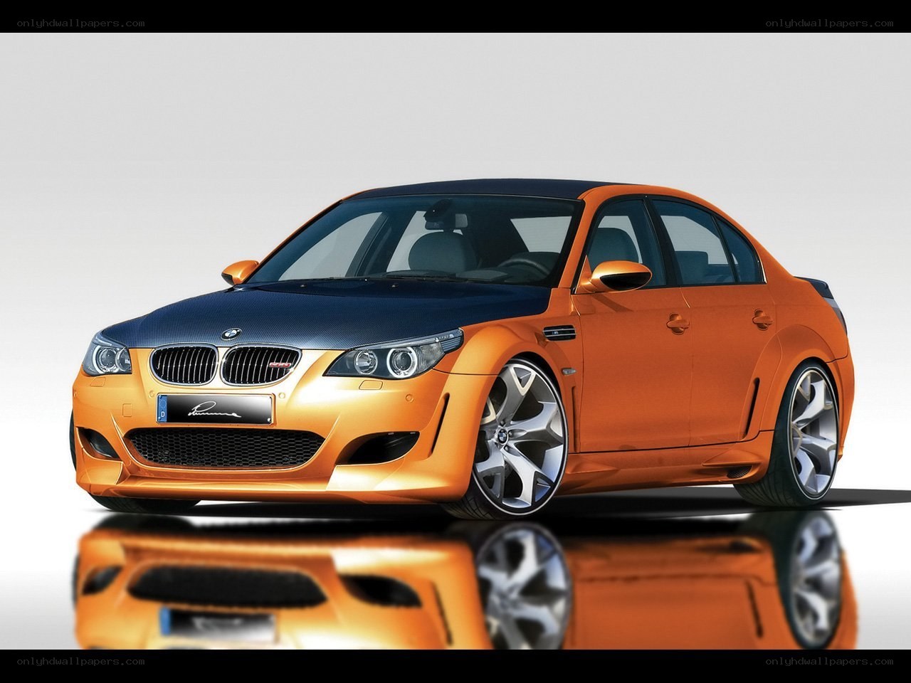 orange BMW M5 sedan