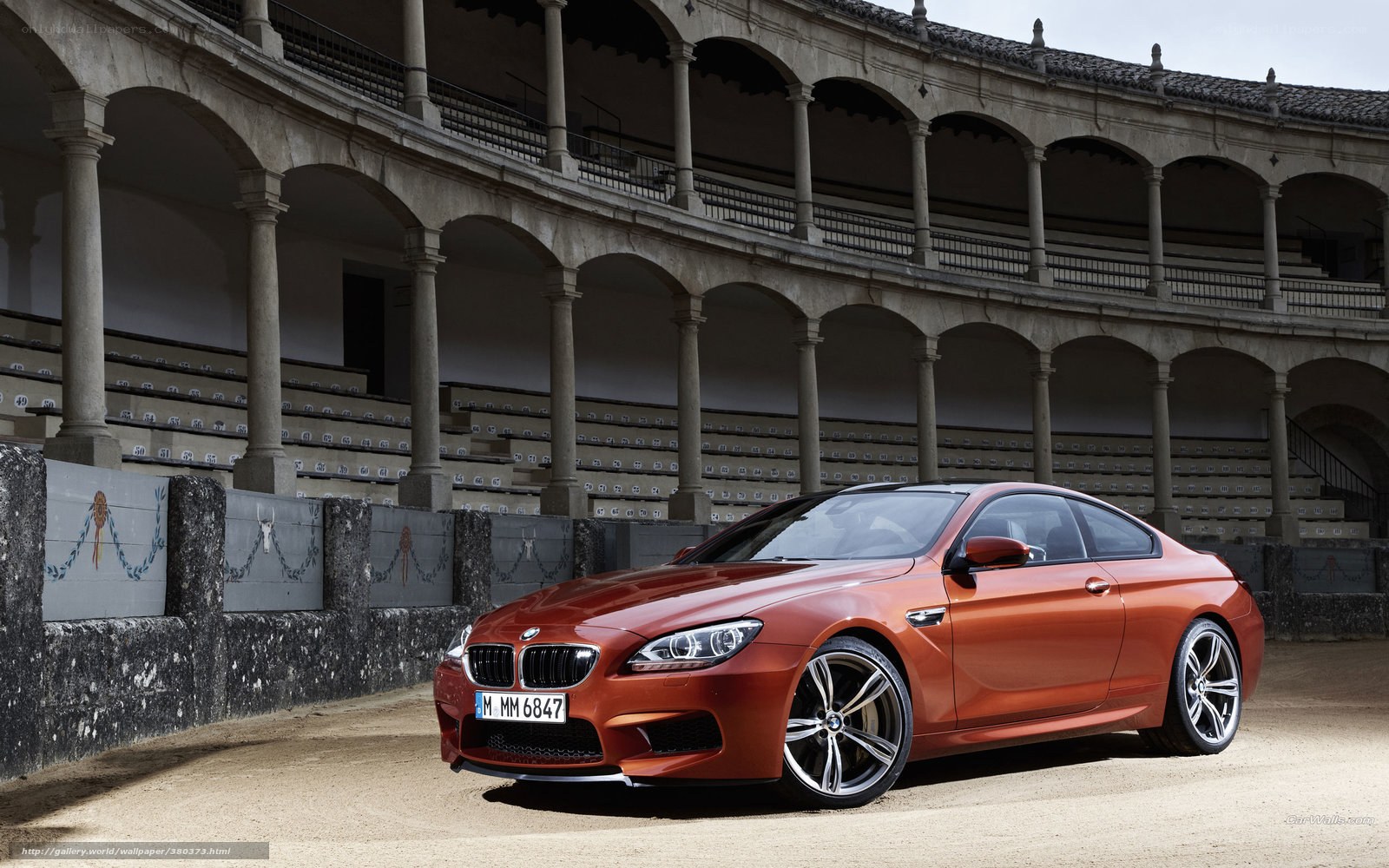 Orange BMW M6 in arena