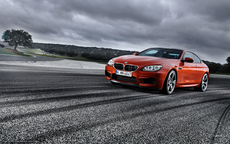 Orange BMW M6 on racetrack