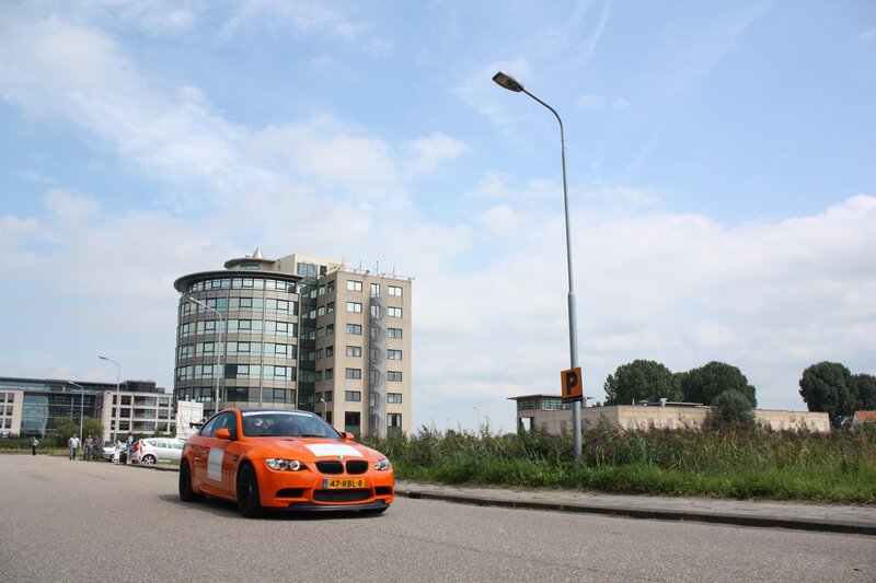 Orange BMW on a city street
