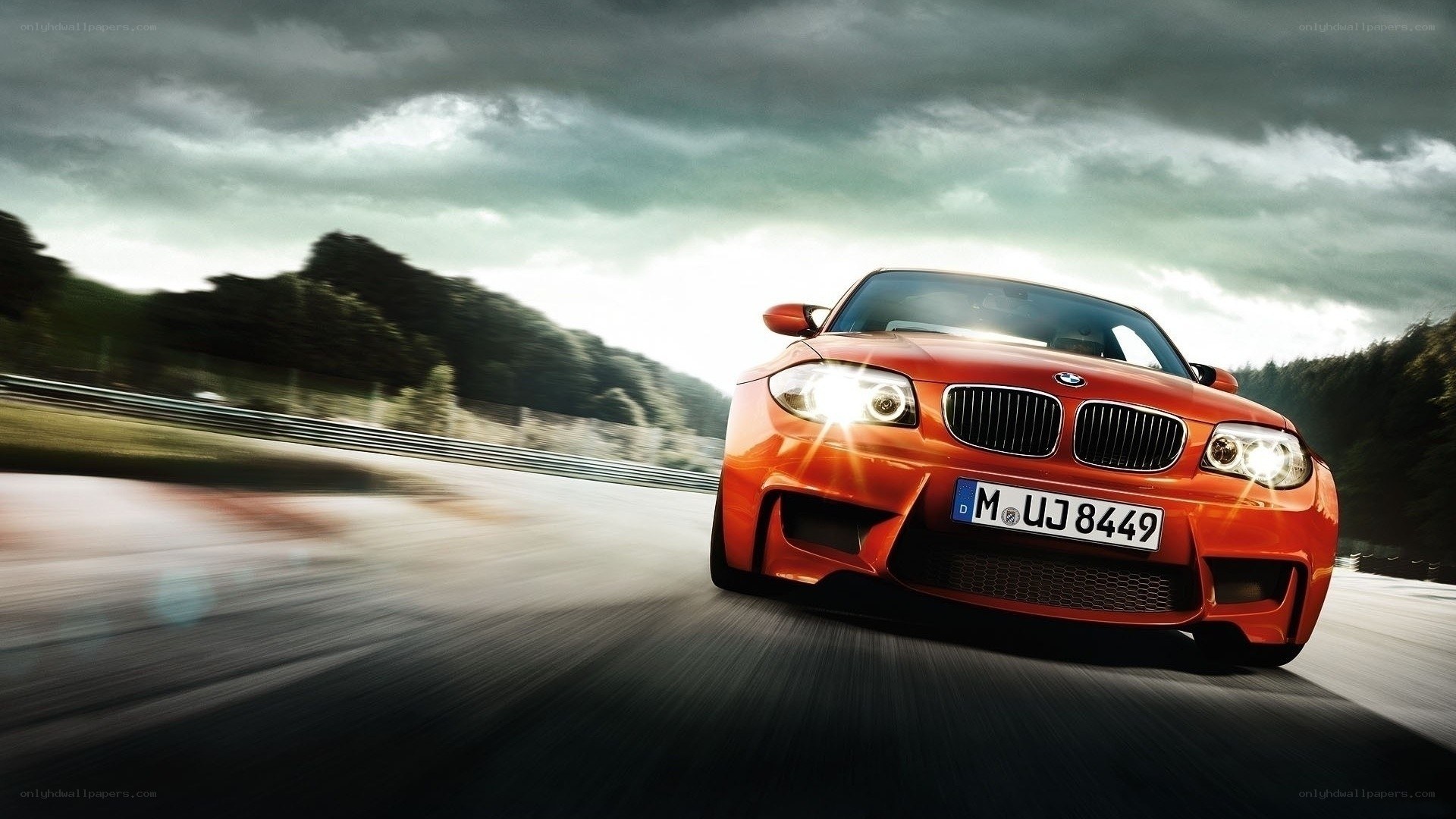 orange BMW on a racetrack