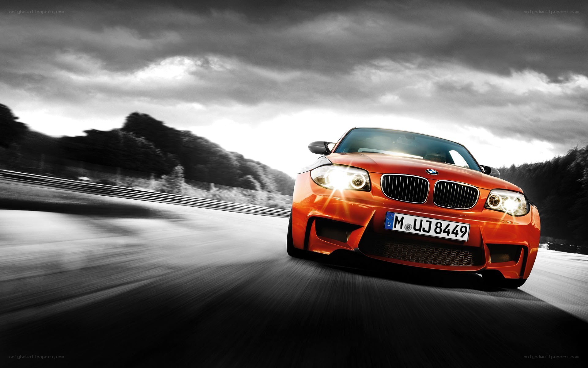 Orange BMW on a racetrack