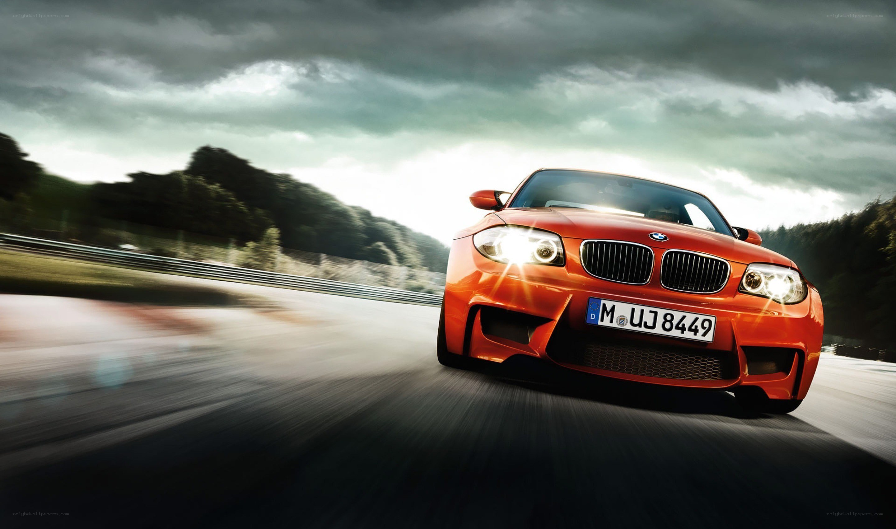 orange BMW on a racetrack