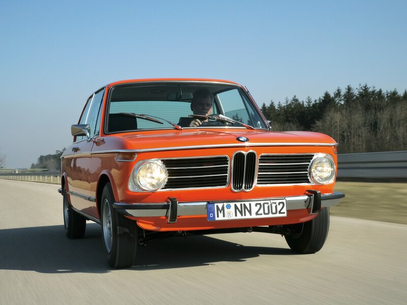 Orange BMW on a road