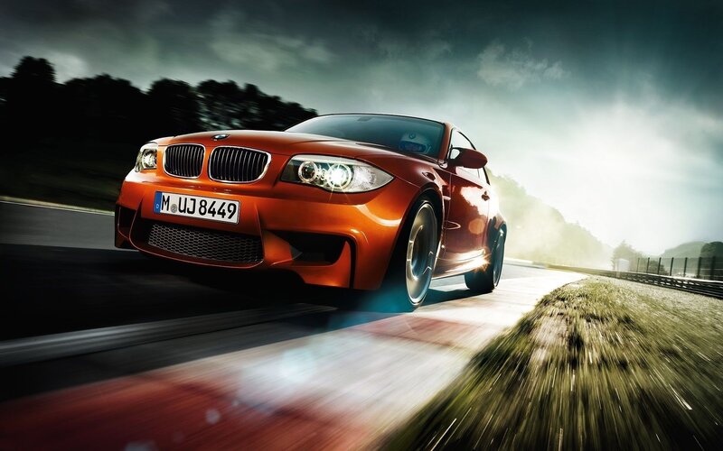 orange bmw on racetrack