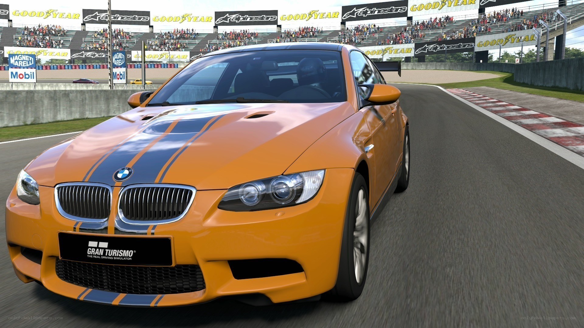 Orange BMW on racetrack