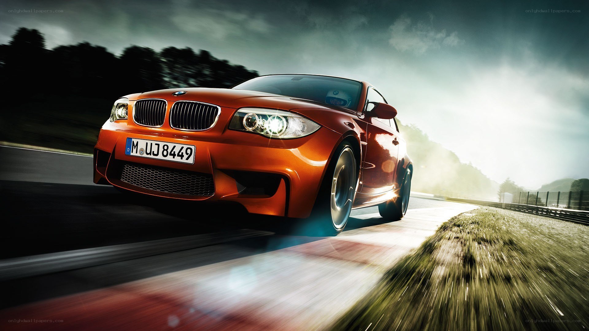 orange BMW on racetrack