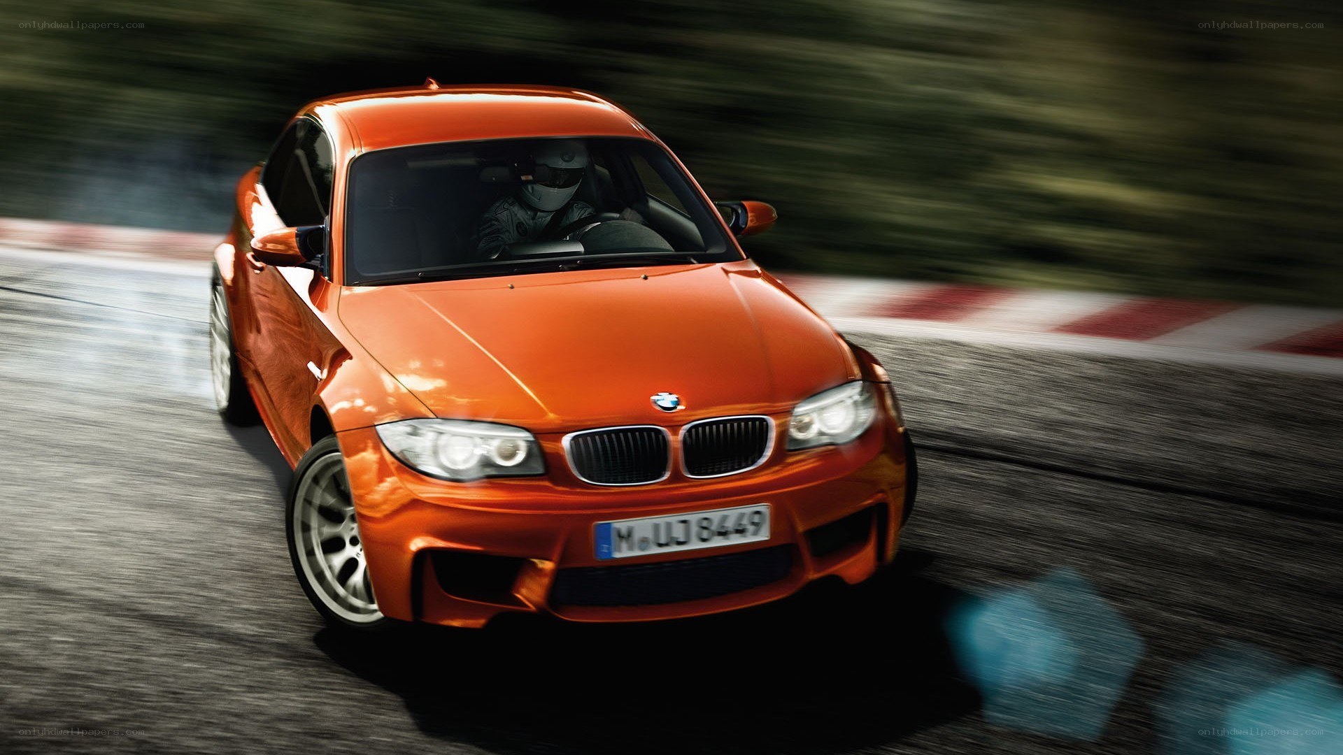orange BMW on racetrack