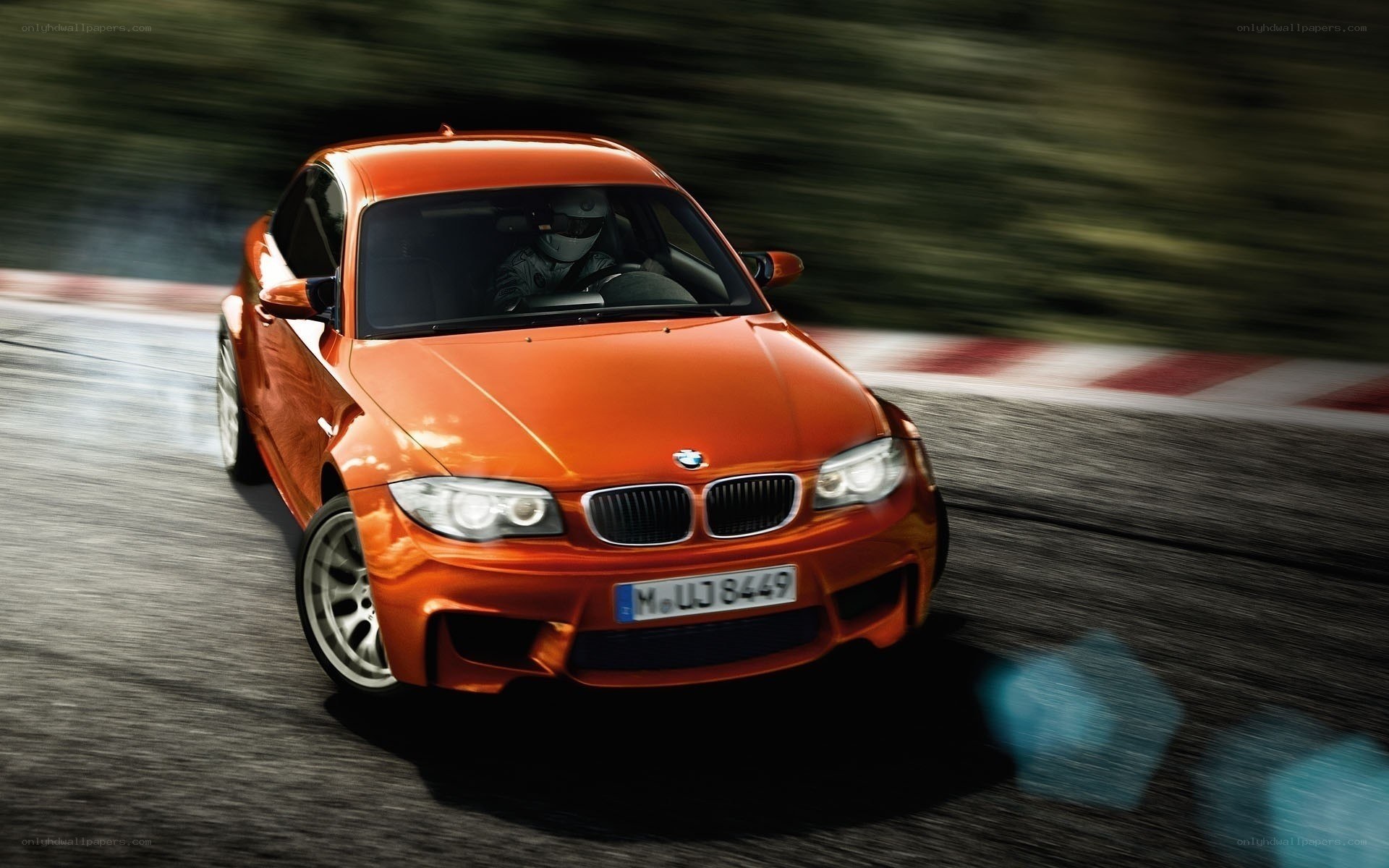 orange BMW on racetrack