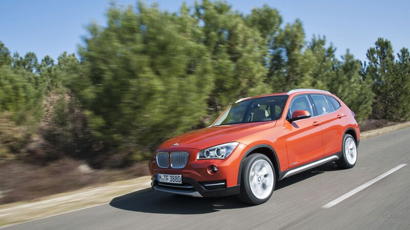 Orange BMW X1 SUV — Dynamic