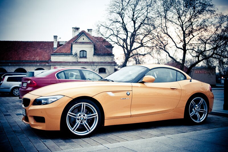 Orange BMW Z4 parked on street