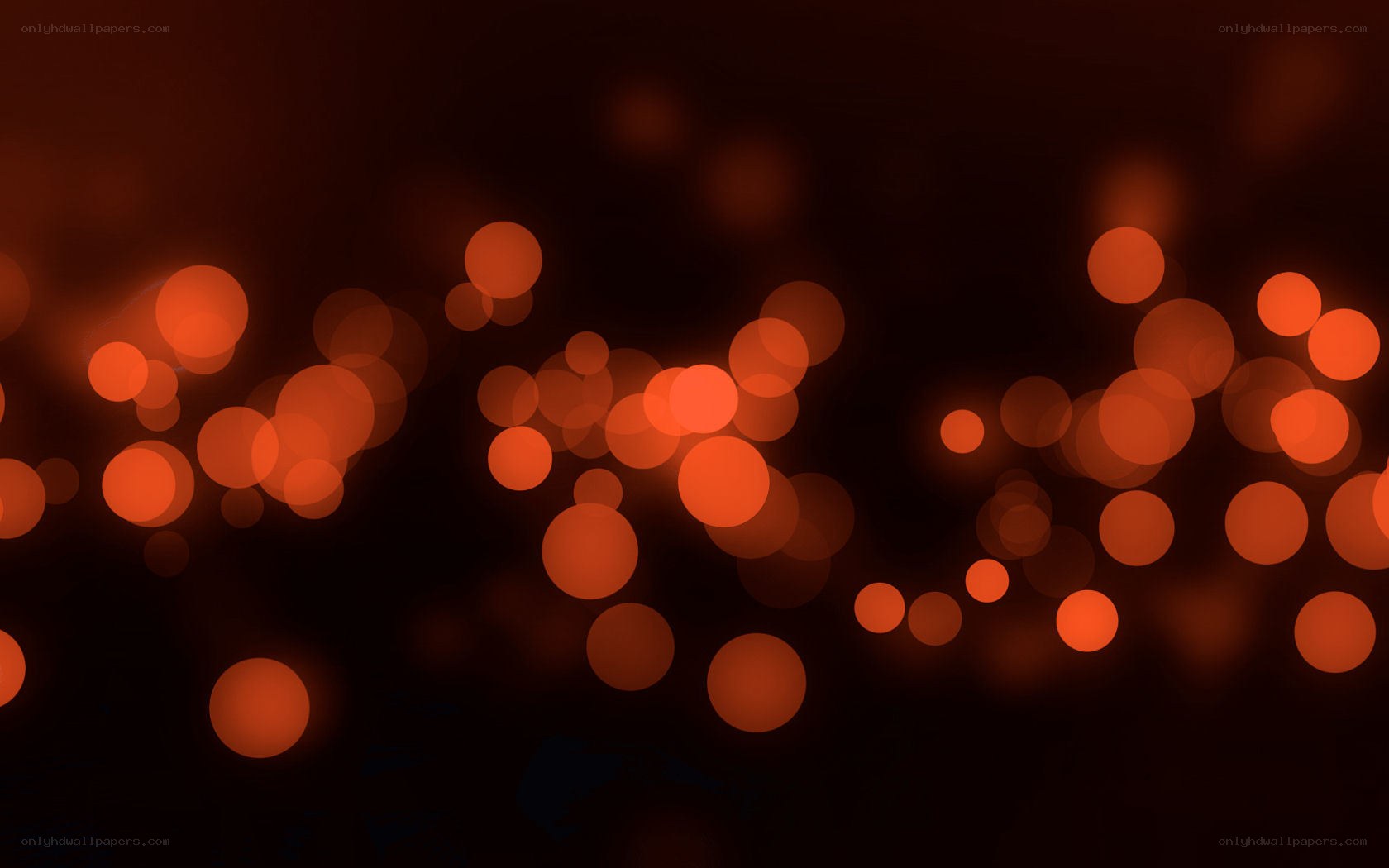 orange bokeh lights on dark