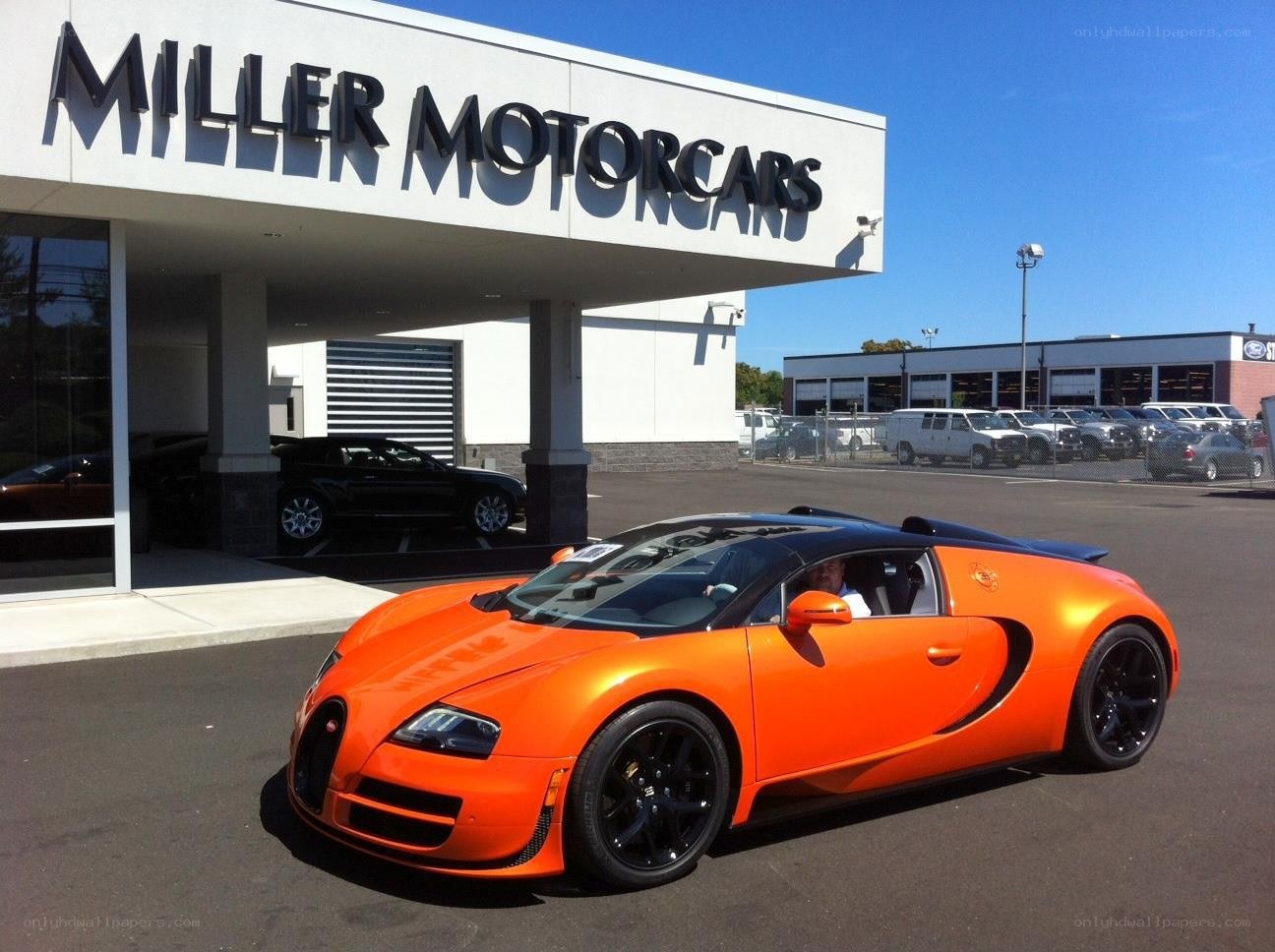 Orange Bugatti Veyron at dealership