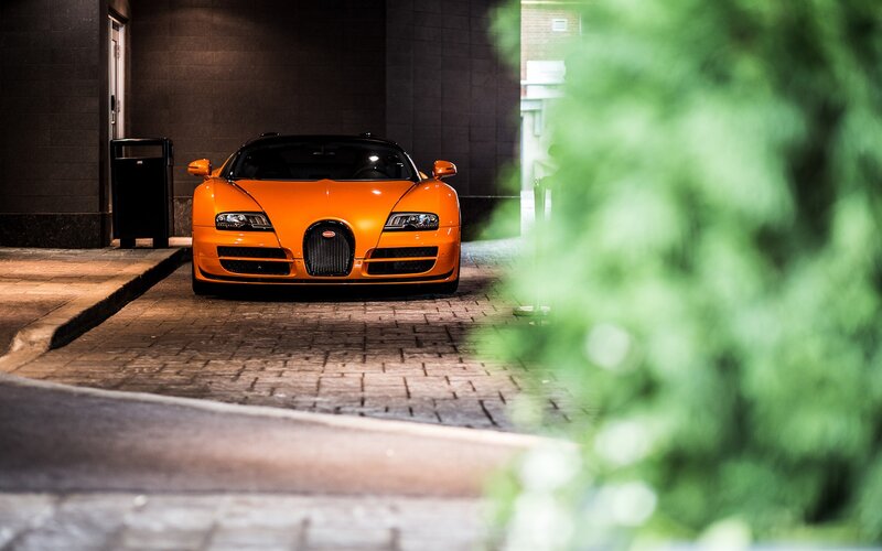Orange Bugatti Veyron at night
