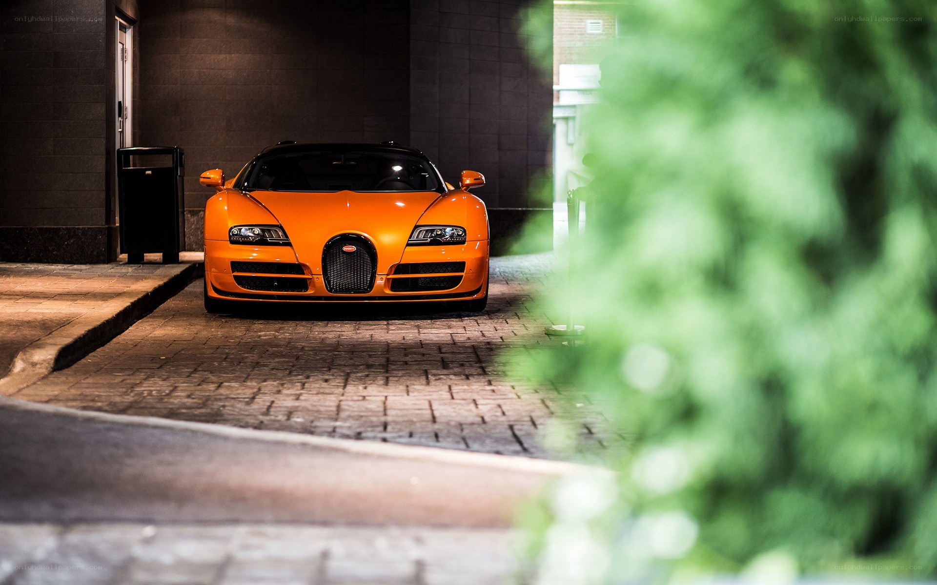 Orange Bugatti Veyron at night