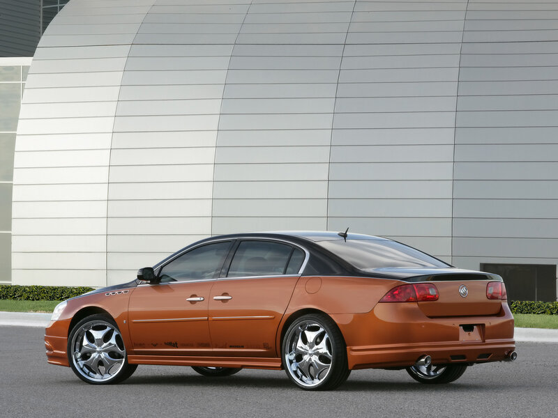 orange Buick sedan with custom wheels