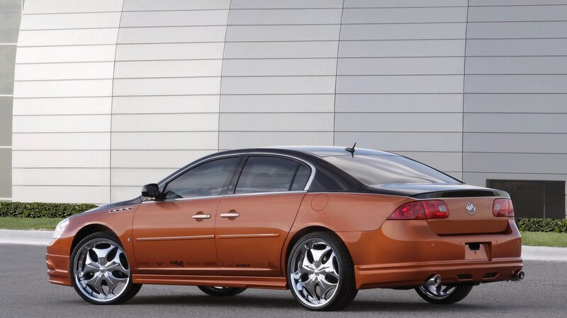 orange Buick sedan with custom wheels