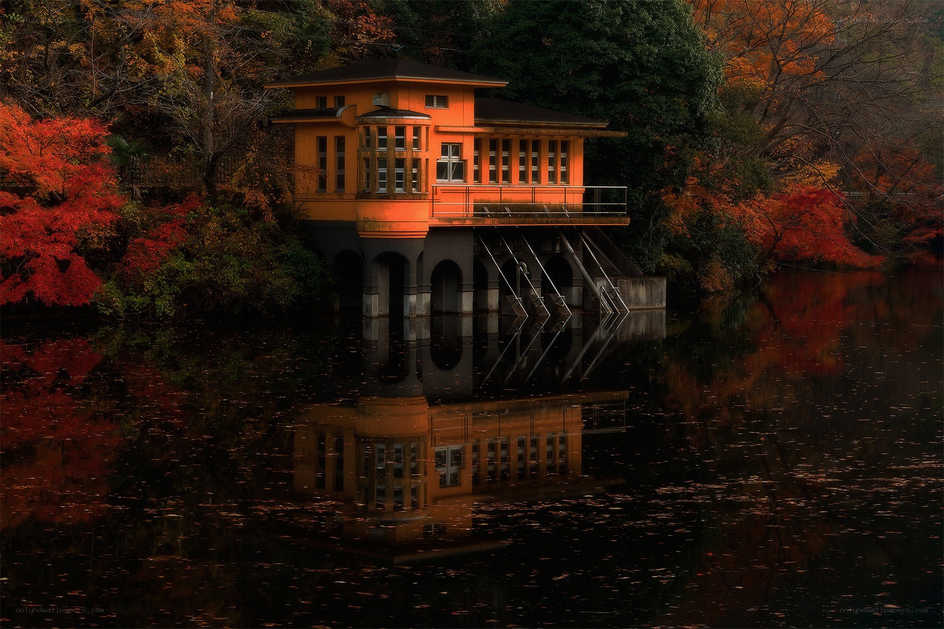 Orange building on a lake