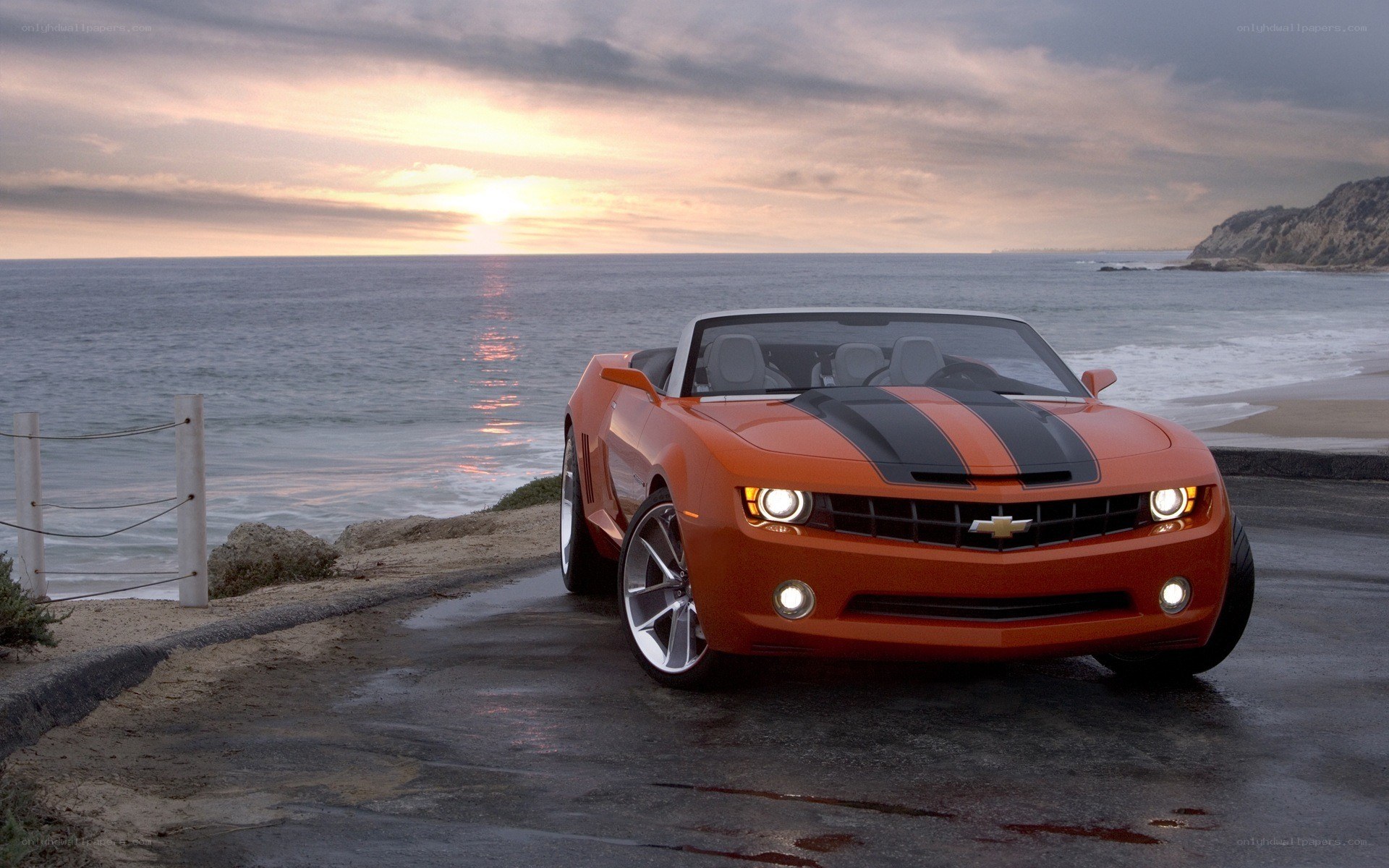Orange Camaro by the ocean