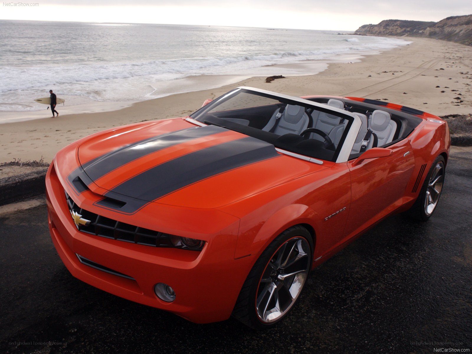 Orange Camaro concept car on beach