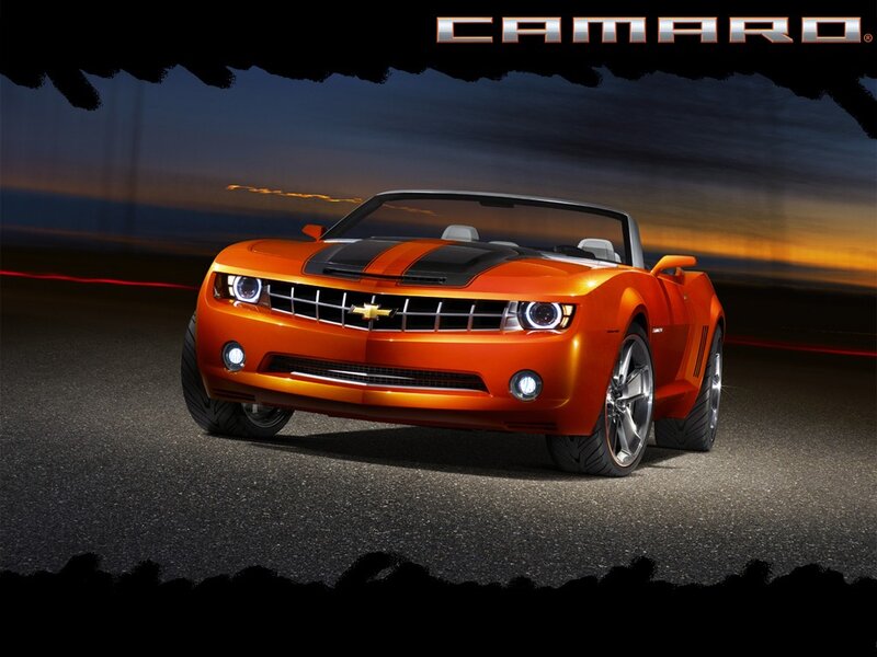 Orange Camaro convertible at night