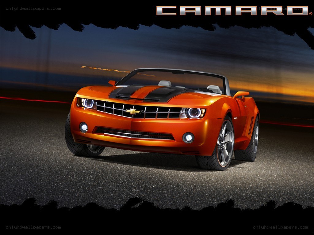Orange Camaro convertible at night