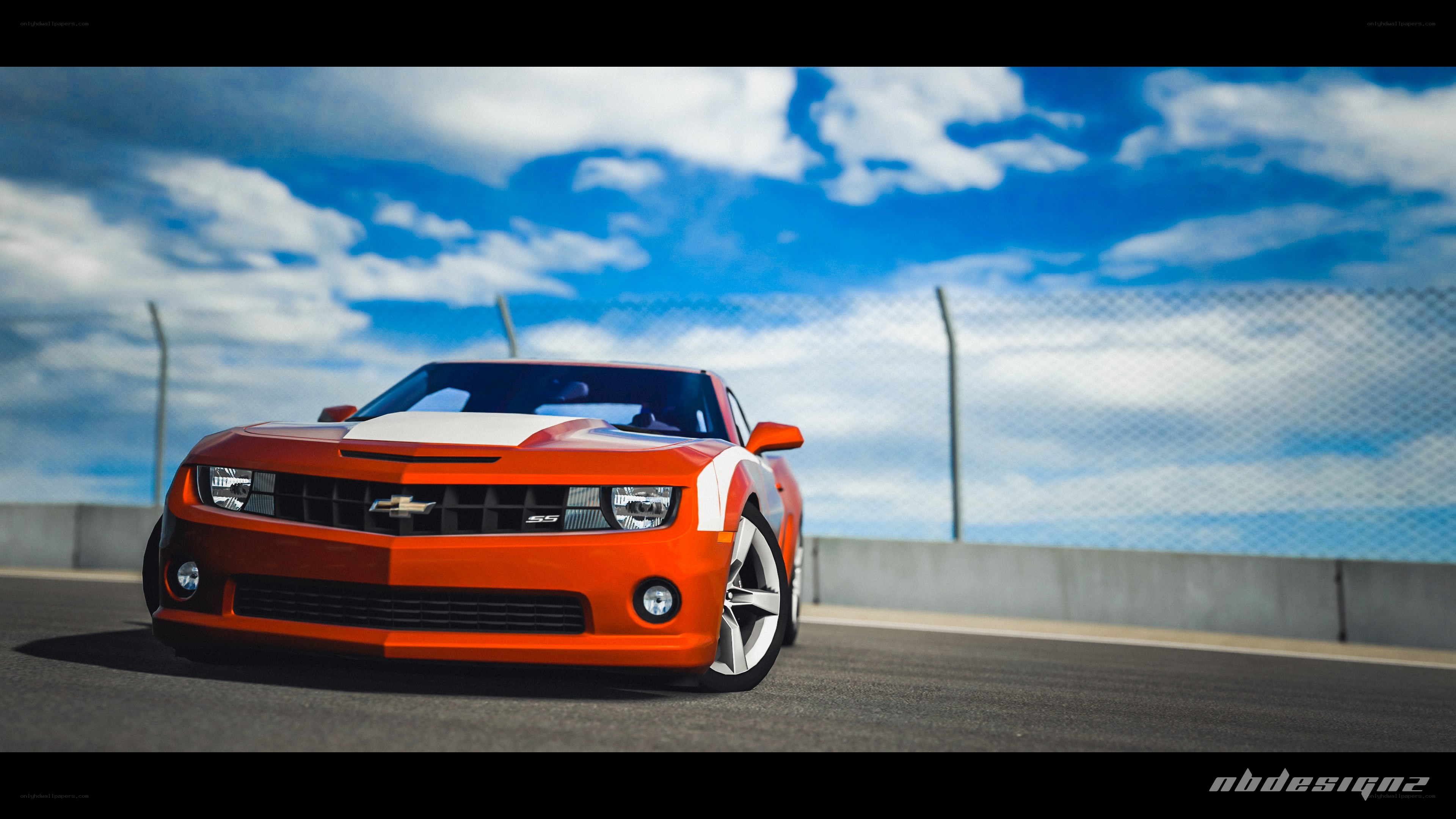 Orange Camaro on a racetrack