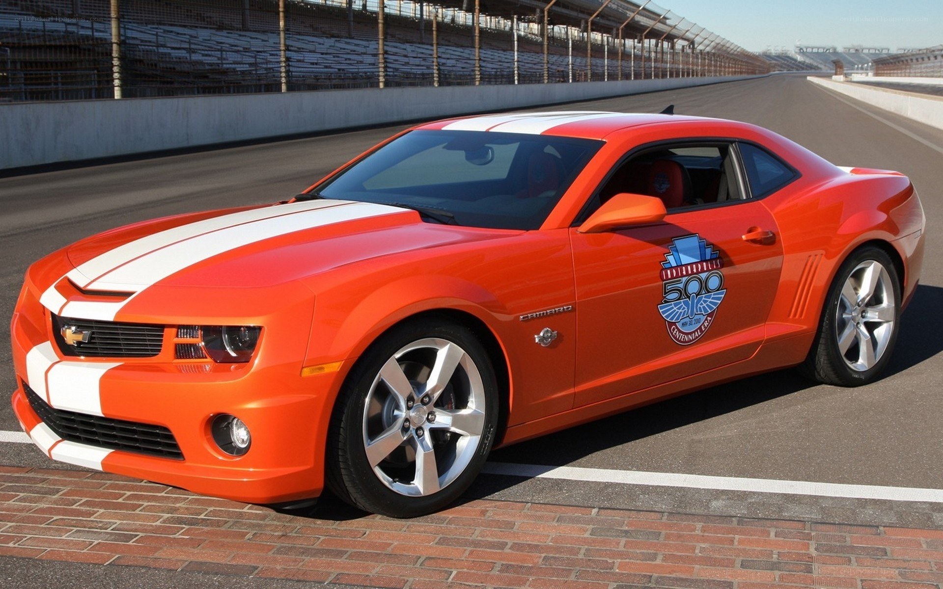 Orange Camaro on racetrack
