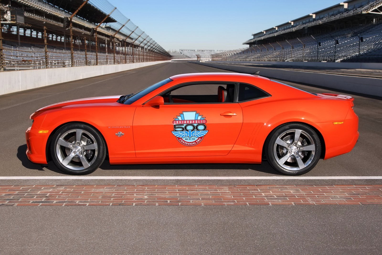 Orange Camaro on racetrack