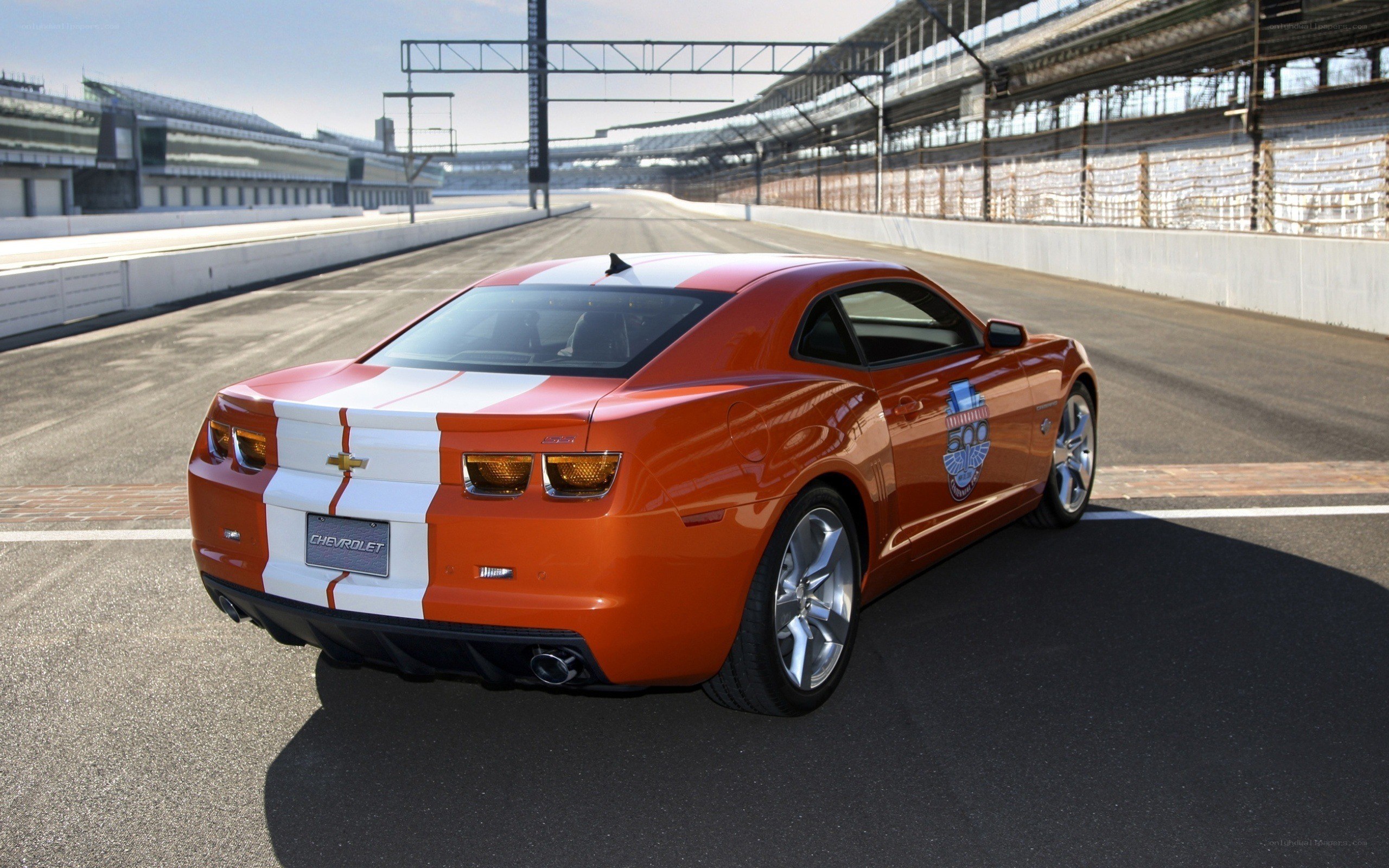 Orange Camaro on racetrack