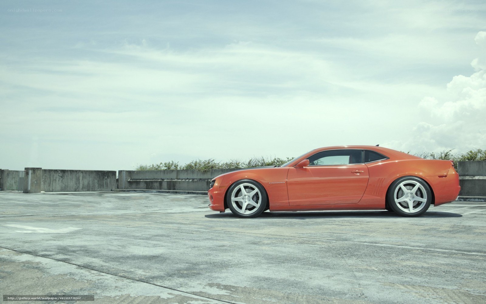 orange camaro on rooftop