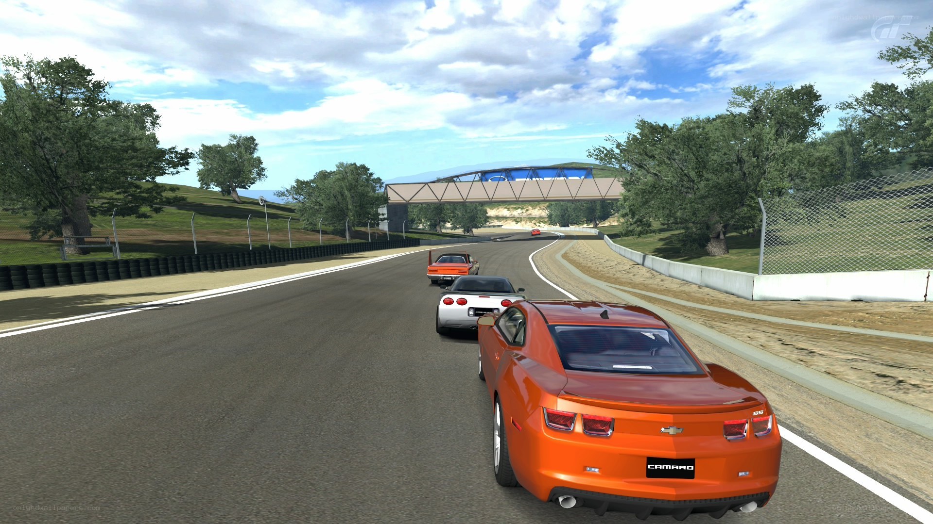 Orange Camaro racing on track
