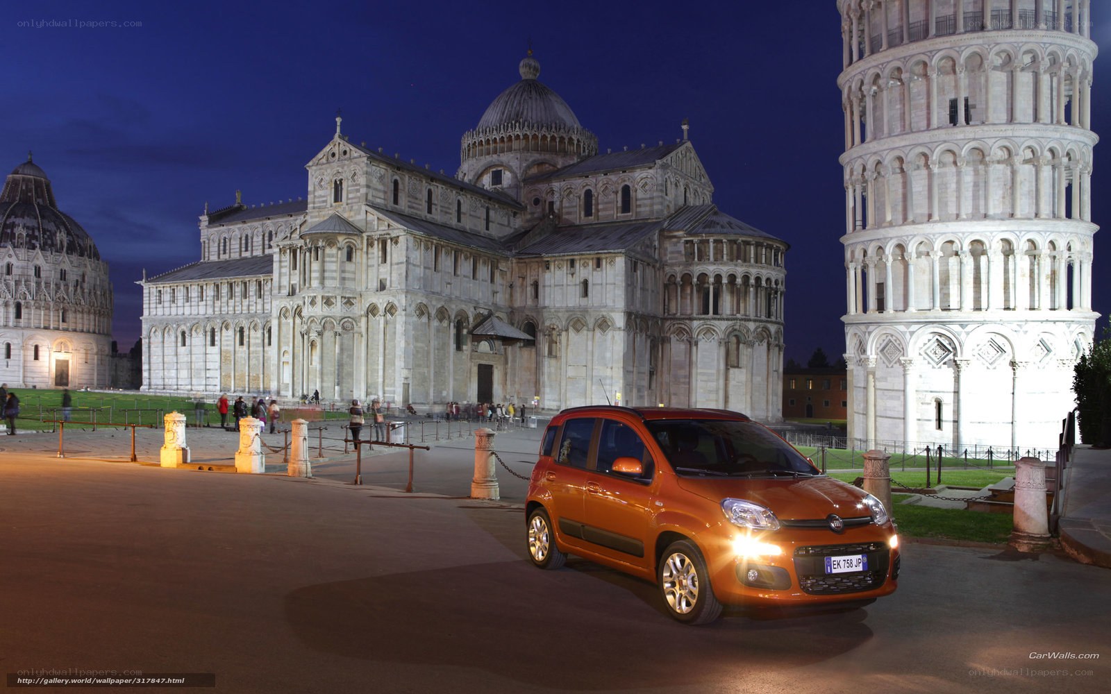 Orange car at Pisa's Leaning Tower