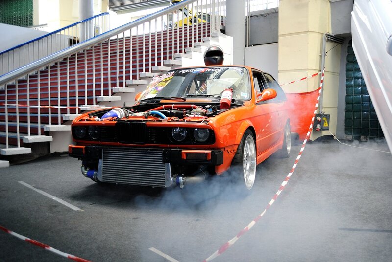 Orange car burnout in garage
