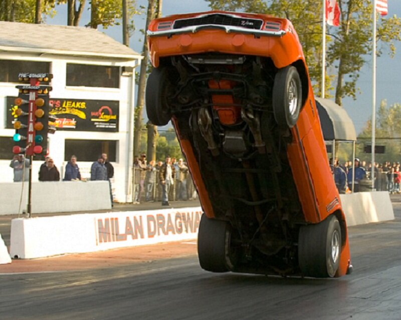 Orange car doing a wheelie