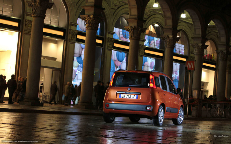 Orange car in a city arcade
